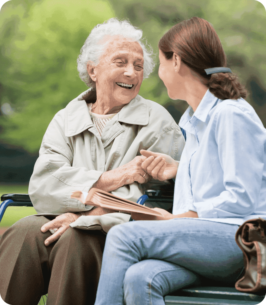Aged care support worker with elderly lady smiling
