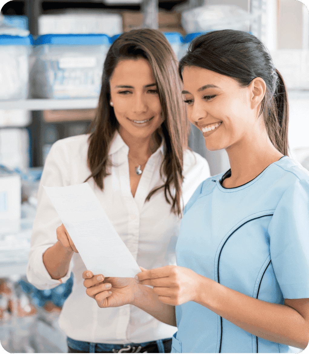 Pharmacy assistant smiling while helping a patient